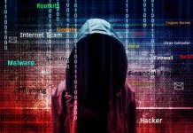 Hooded figure with cybersecurity terms and binary code background