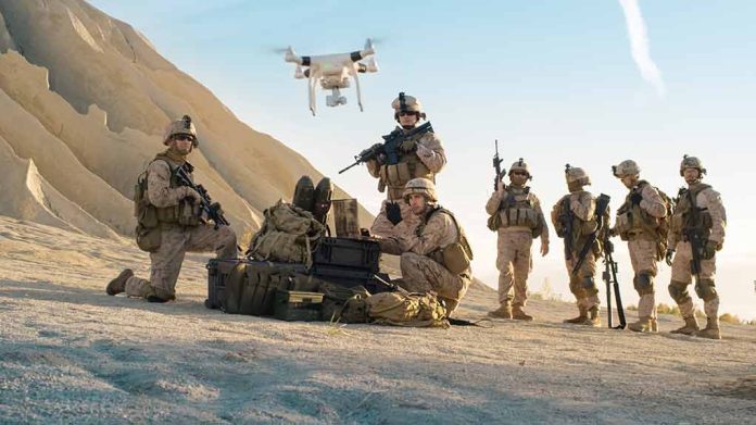 676000819 featured image Soldiers operating drone in desert landscape with equipment