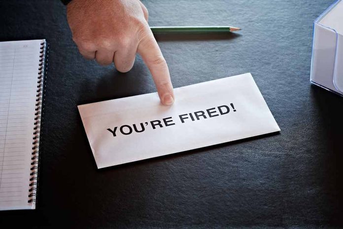 Envelope with YOU'RE FIRED and pointing finger