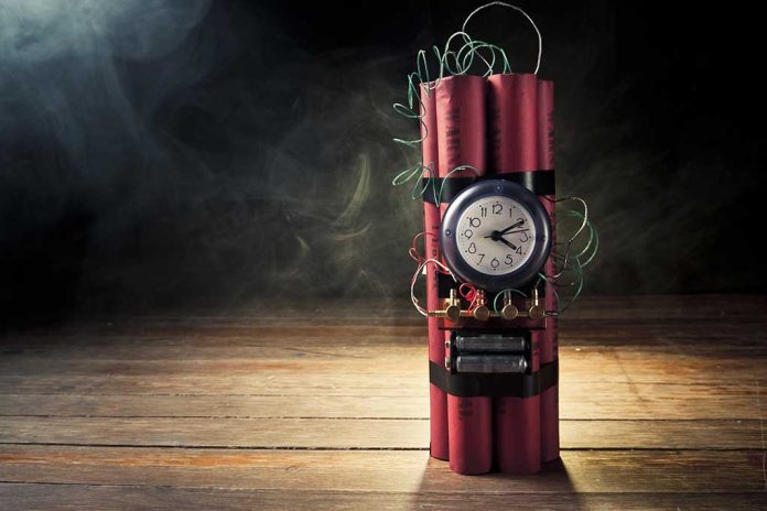 87180130 featured image Dynamite bundle with a clock timer on wooden floor