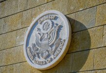 United States of America embassy emblem on wall