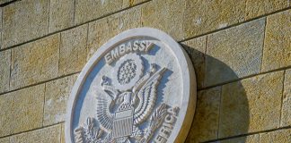 United States of America embassy emblem on wall