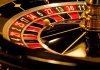Closeup of roulette wheel with spinning ball