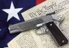 Gun on US Constitution and flag