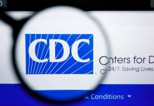CDC logo magnified on a screen