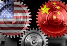 Interlocking gears with USA and China flags