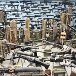 Room filled with various firearms and ammunition belts