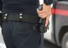 Person holding a gun in a holster
