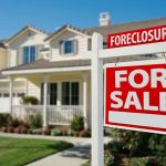 House for sale with foreclosure sign