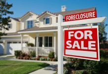House for sale with foreclosure sign