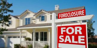 House for sale with foreclosure sign