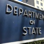 Department of State sign in front of building