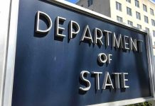Department of State sign in front of building