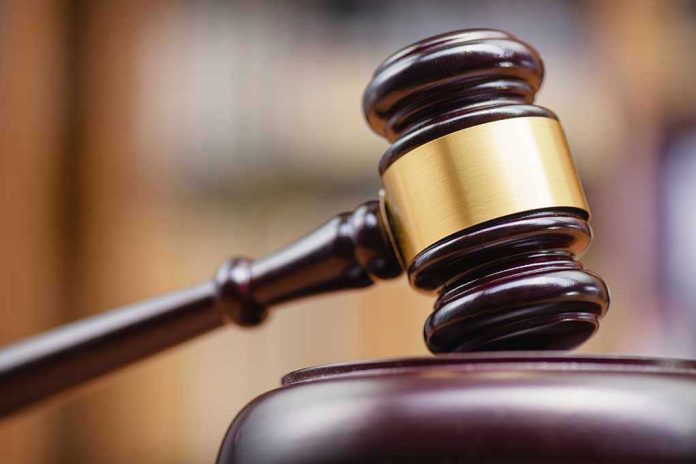 1334292137 Judge's gavel striking a sound block