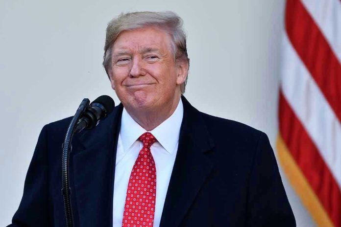 1572261577 Man in suit and tie speaking at podium