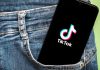 Phone with TikTok logo in jeans pocket