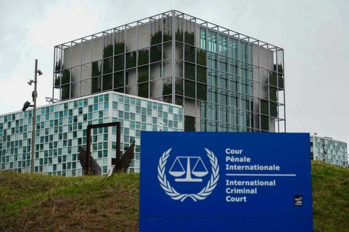 2412227789 International Criminal Court building with sign in foreground.