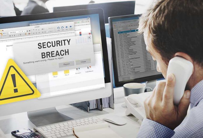 432988318 Security breach alert displayed on computer monitor