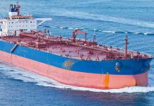 Large cargo ship navigating through the ocean
