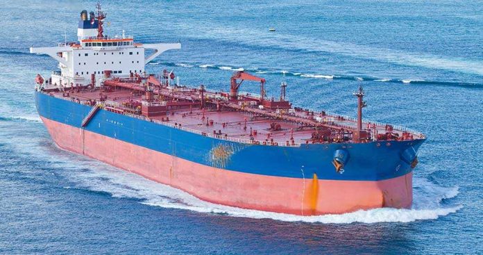 shutterstock_169715141.jpg Large cargo ship navigating through the ocean