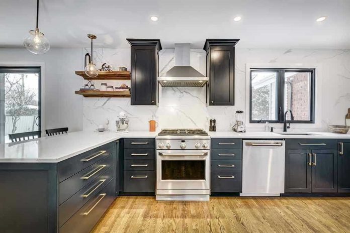 1684127182 Modern kitchen with black cabinets and stainless appliances.