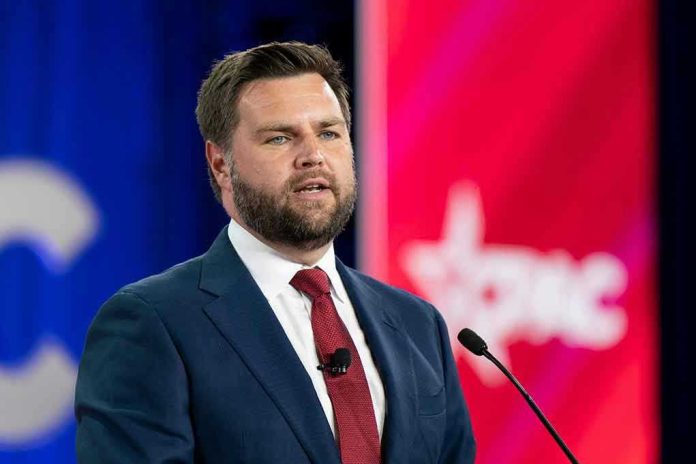2186937099 Man in a suit speaking at a podium.