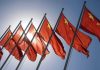 Red flags with yellow stars on flagpoles