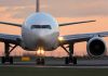 Airplane on runway during sunset