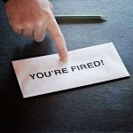 Envelope with YOU'RE FIRED and pointing finger.