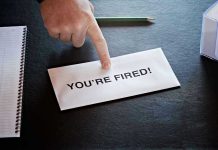 Envelope with YOU'RE FIRED and pointing finger.