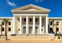 Exterior view of the Supreme Court of Florida with columns and palm trees