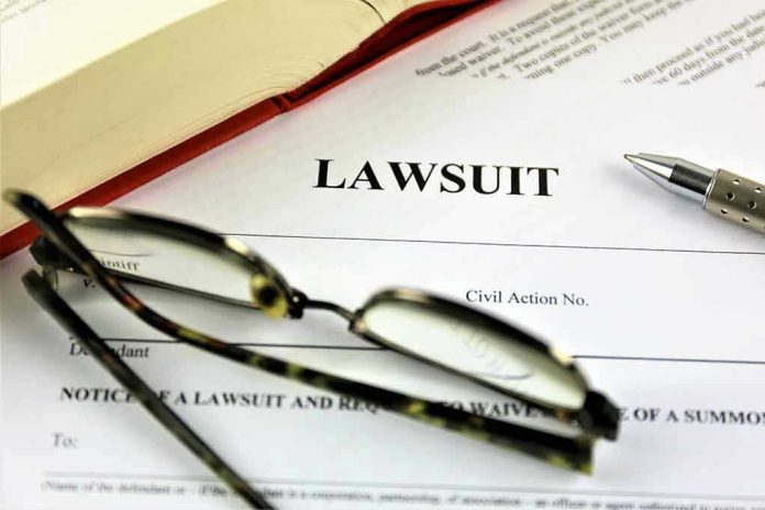 Lawsuit document with glasses, pen, and book.