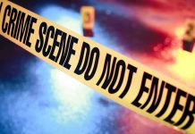 Crime scene tape with do not enter text.