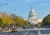 View of the Capitol building in Washington D.C. with autumn trees lining the street
